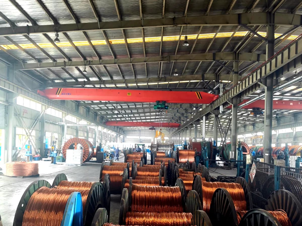 Large cable drum handled by overhead crane in Huanyu Cable workshop
